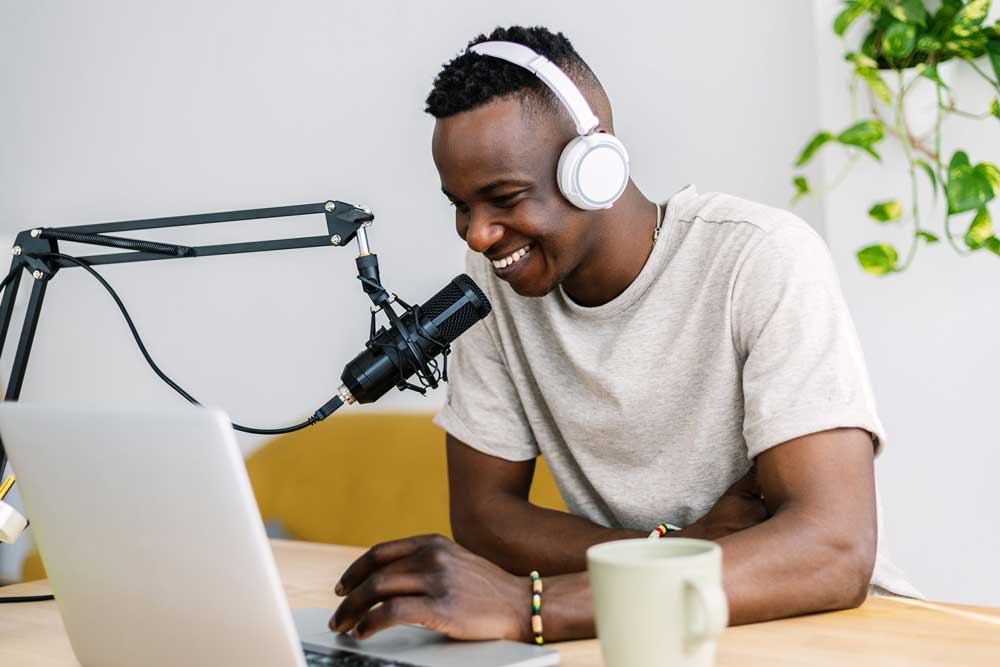 young-african-creator-man-recording-radio-content-2022-12-09-04-35-03-utc